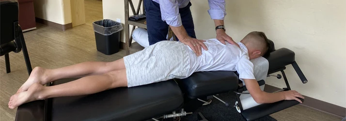 Chiropractor Oro Valley AZ Daniel Marsh Adjusting Client Back Pain